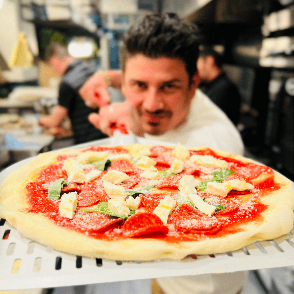 Marco with Pizza