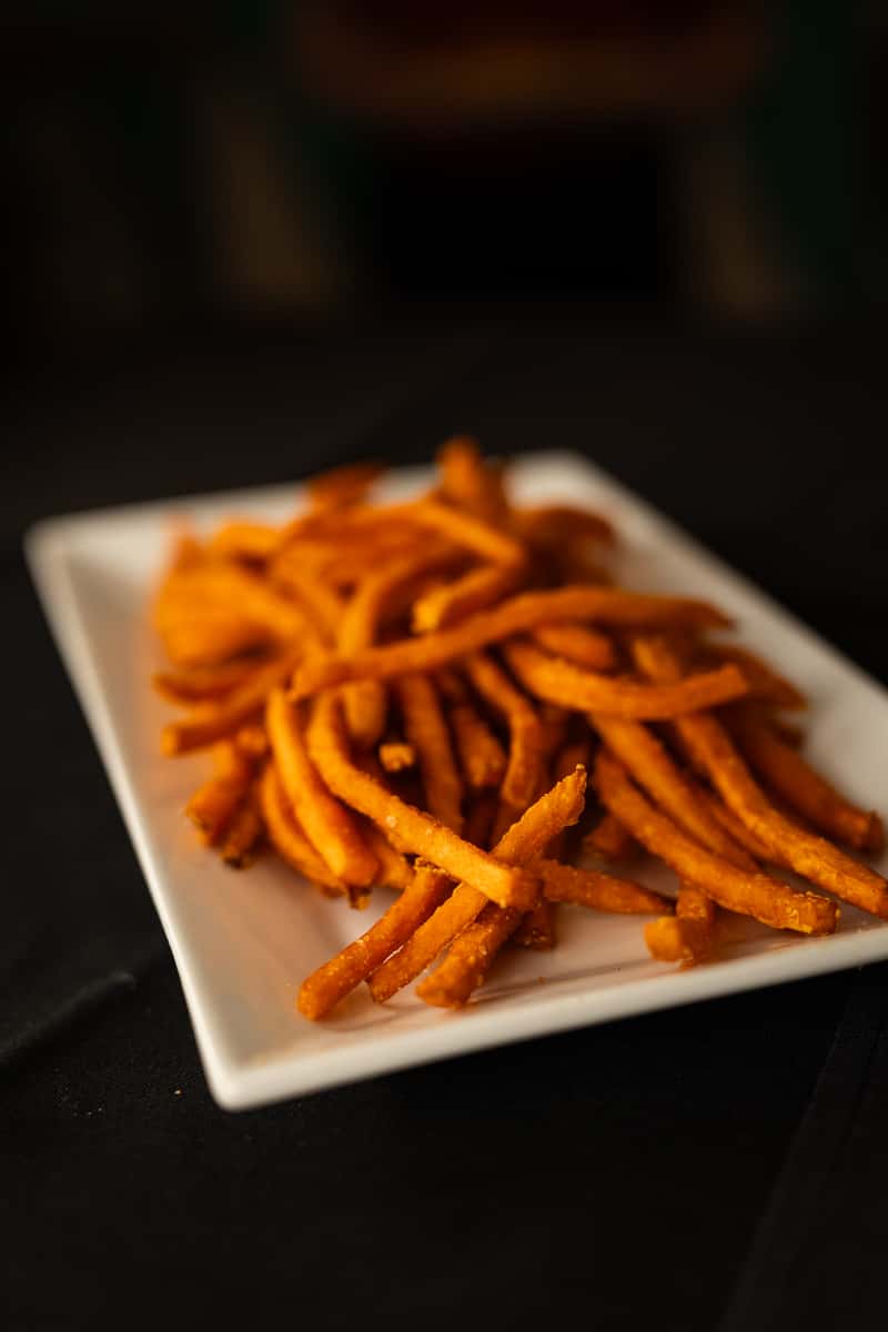 sweet potato fries on a white plate