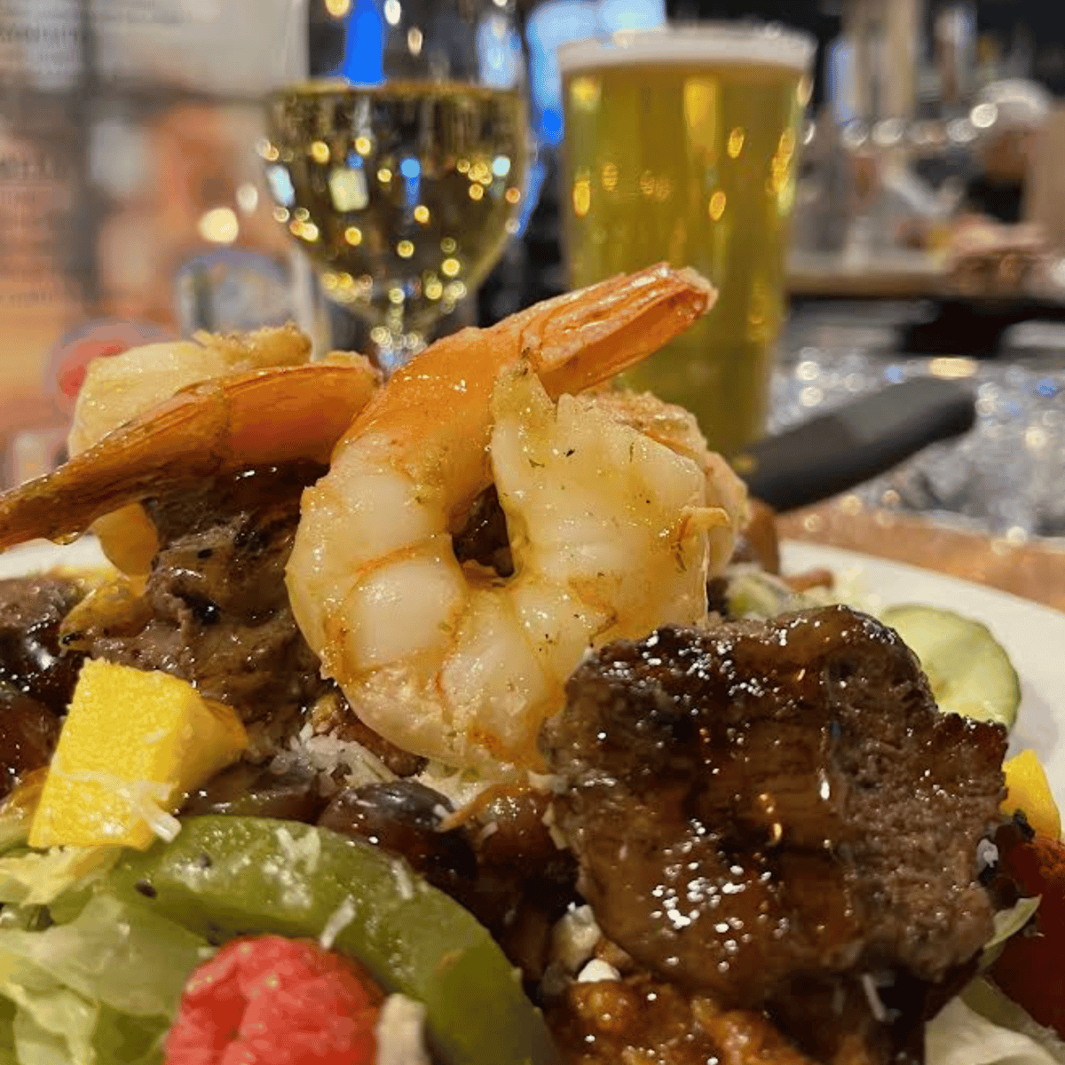 Mixed greens topped with fresh strawberries, blueberries, pineapple, mandarin oranges, candied walnuts, bleu cheese crumbles and blueberry bread croutons. Served with raspberry vinaigrette dressing and bbq glazed Chicken $18,Turkey Tips...$18, Steak Tips...$20 Jumbo Shrimp...$20 Salmon...$21