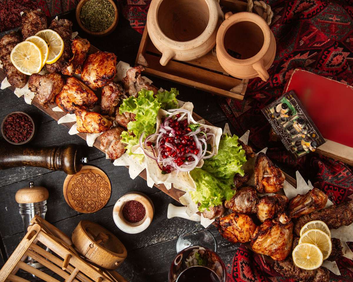 Indian grilled meat platter with salad, spices and flatbread