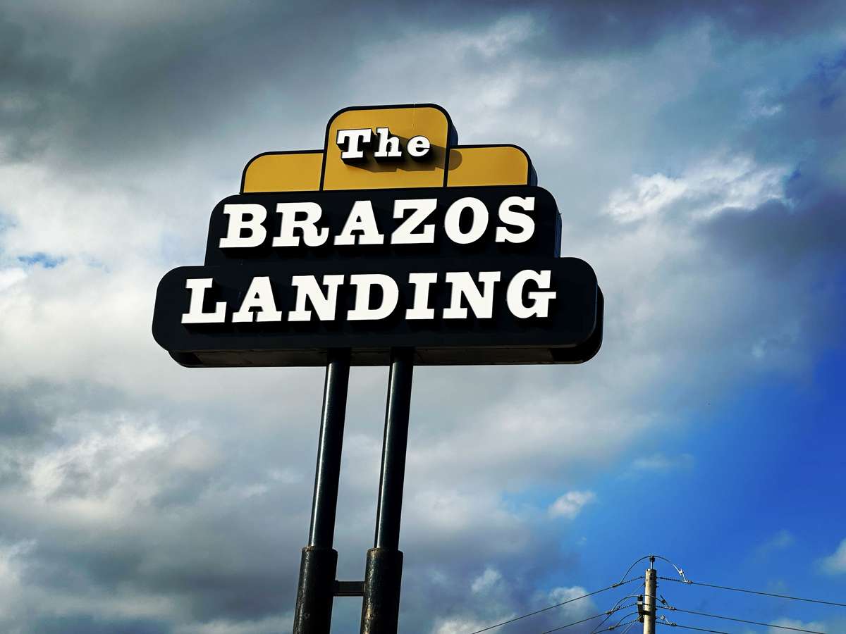 The Brazos Landing Pole Sign