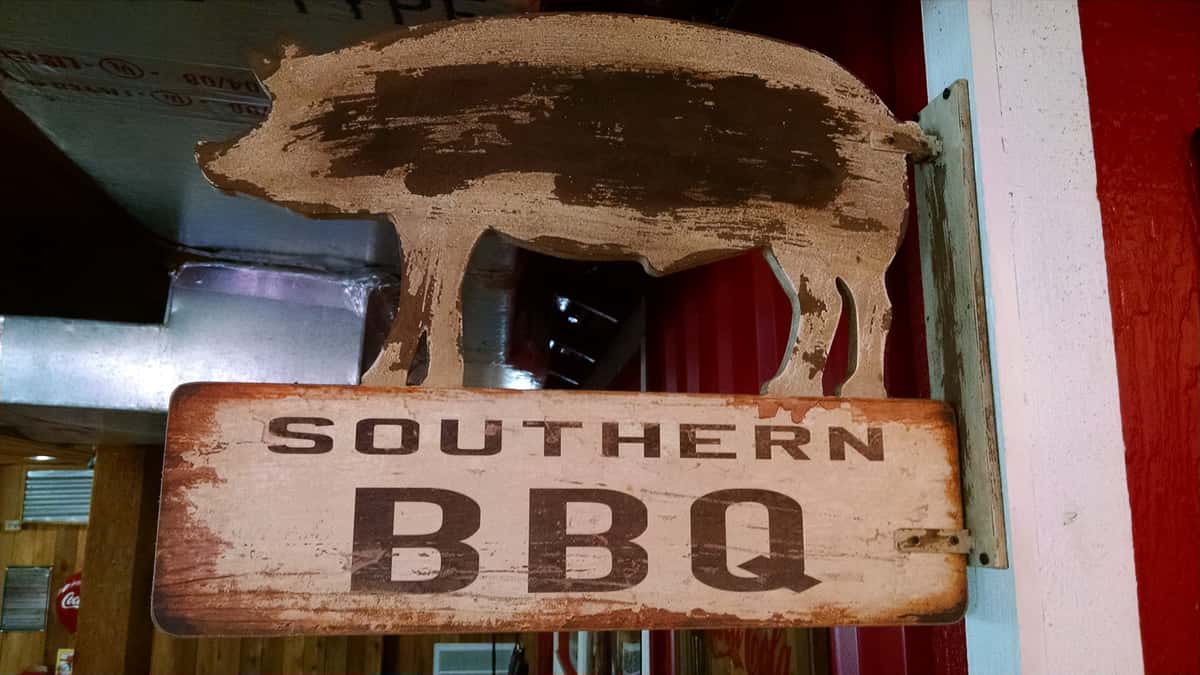 decorative sign inside the building of a pig that says "Southern BBQ" 