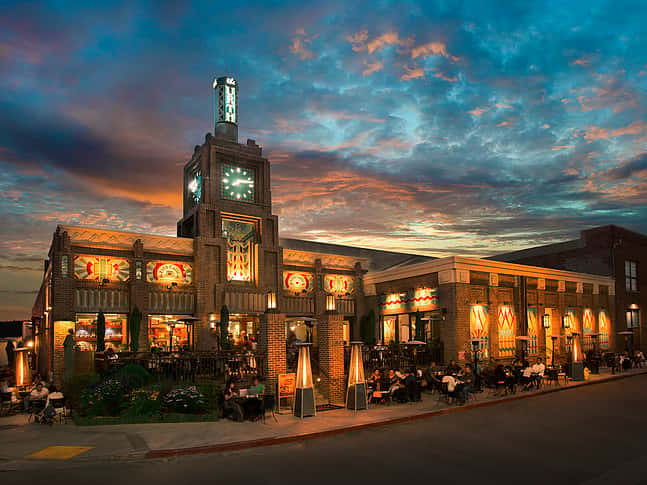 Exterior of Urth Caffe Downtown Los Angeles with sunset and clouds behind it
