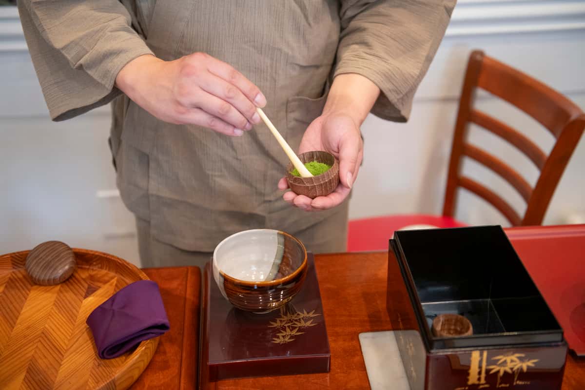 Japanese tea ceremony with ritual purple cloth