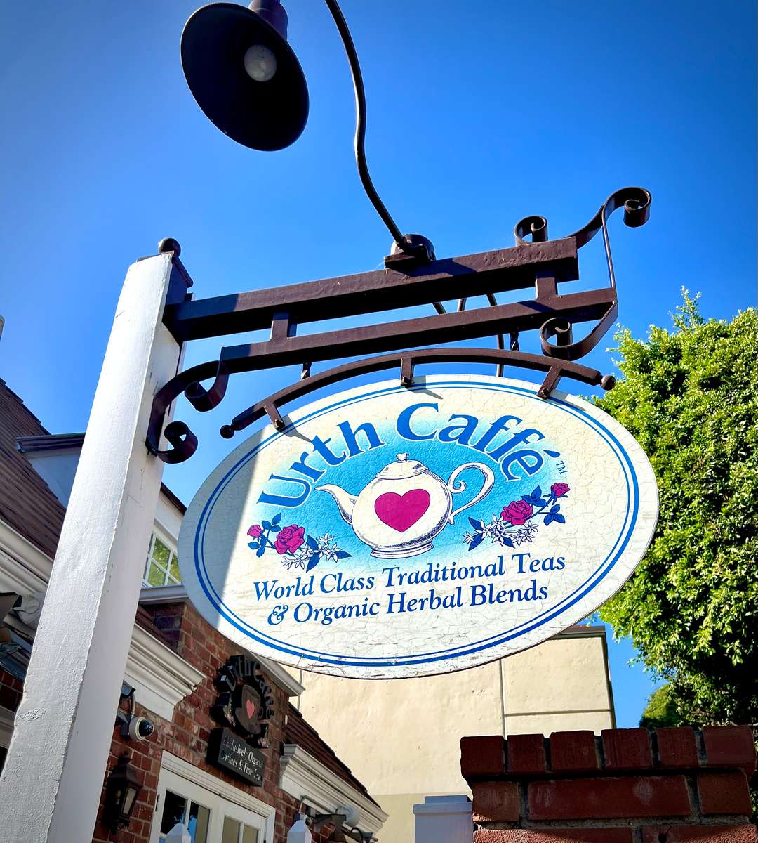 Outdoor sign with teapot and heart - Urth Caffé BH