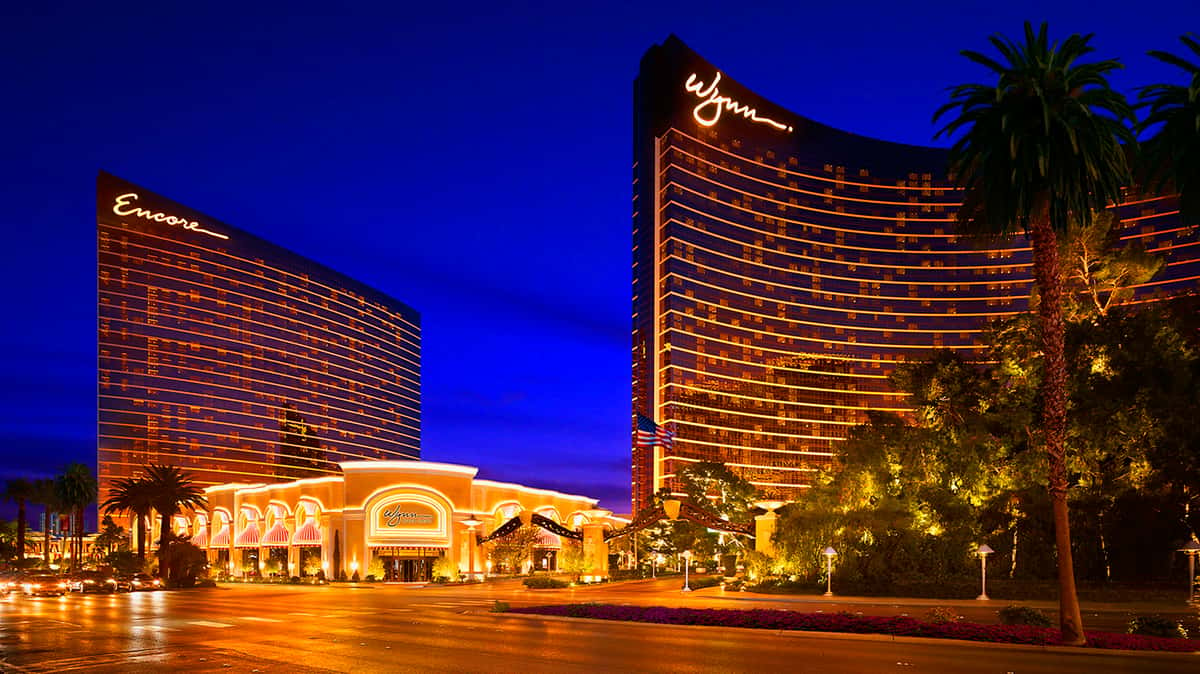 Night time exterior photo of the Wynn and Encore Hotels and Wynn Plaza Shops