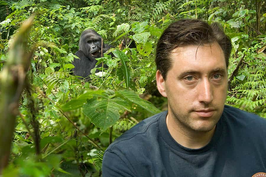 Urth Caffe co founder Shallom Berkman in foreground, gorilla in background, in jungle
