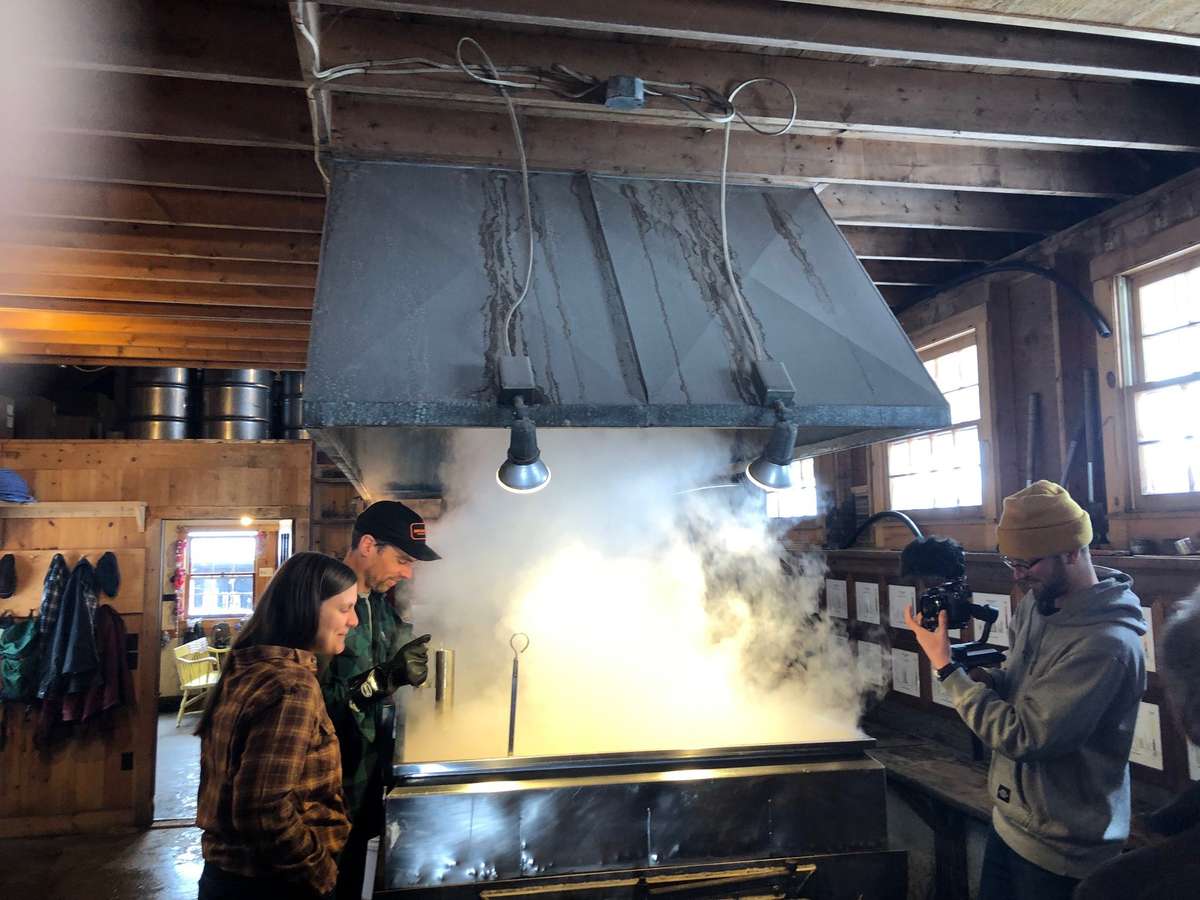 Boiling down maple sap to make maple syrup