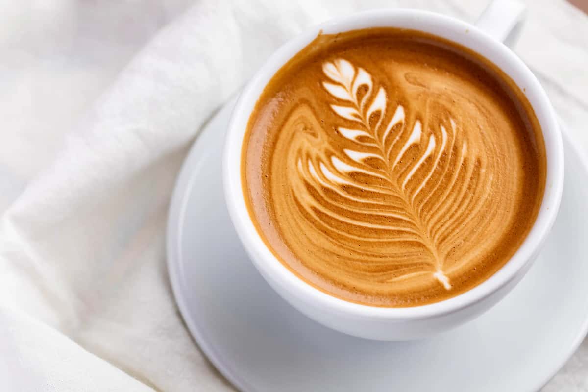 Urth Spanish Latte on a white tablecloth