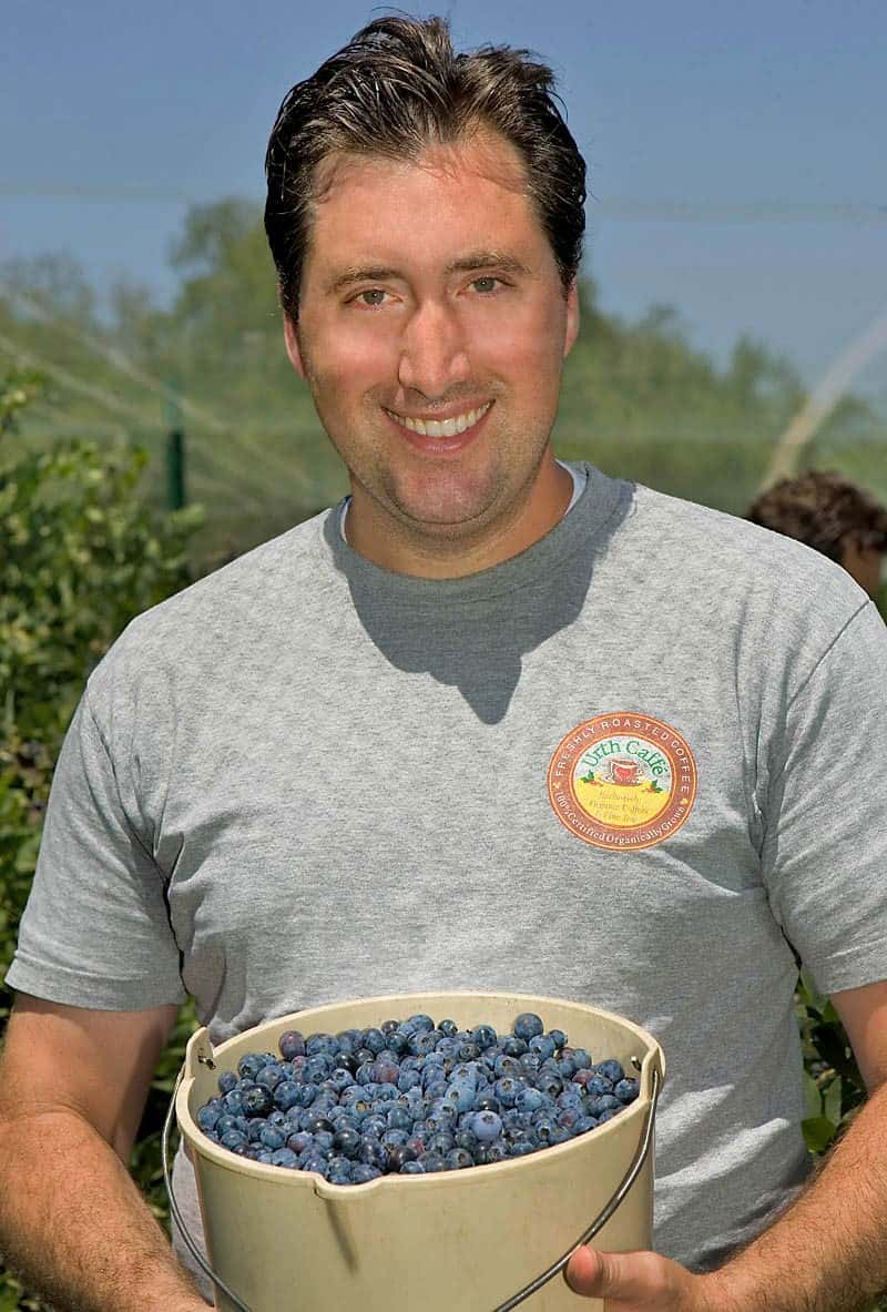 Urth Caff´c0-founder Shallom Berkman holds a bucket of blueberries