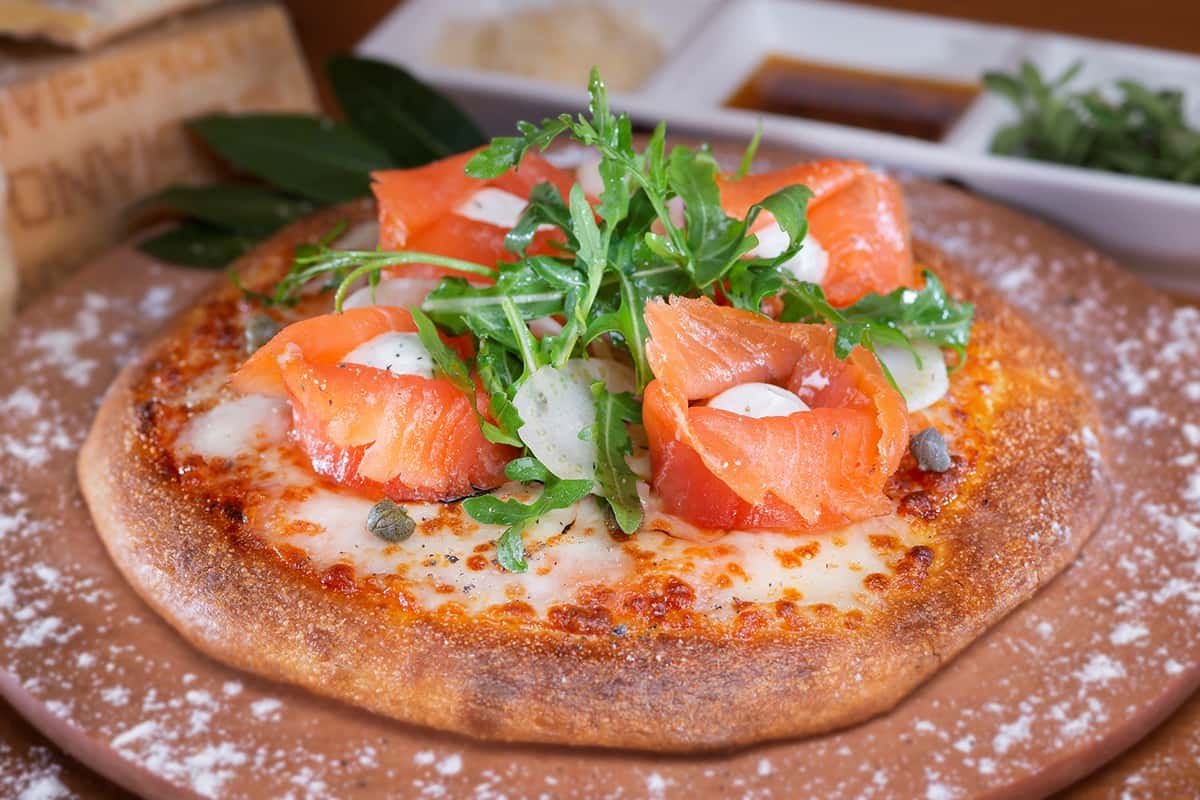 Middle photo - D'Lox Pizza topped with lox.