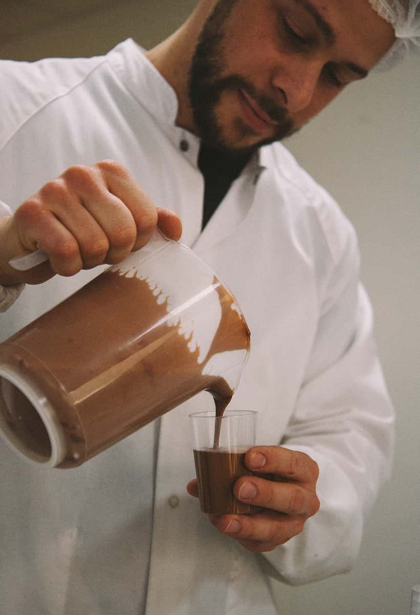 Chocolate pouring from pitcher