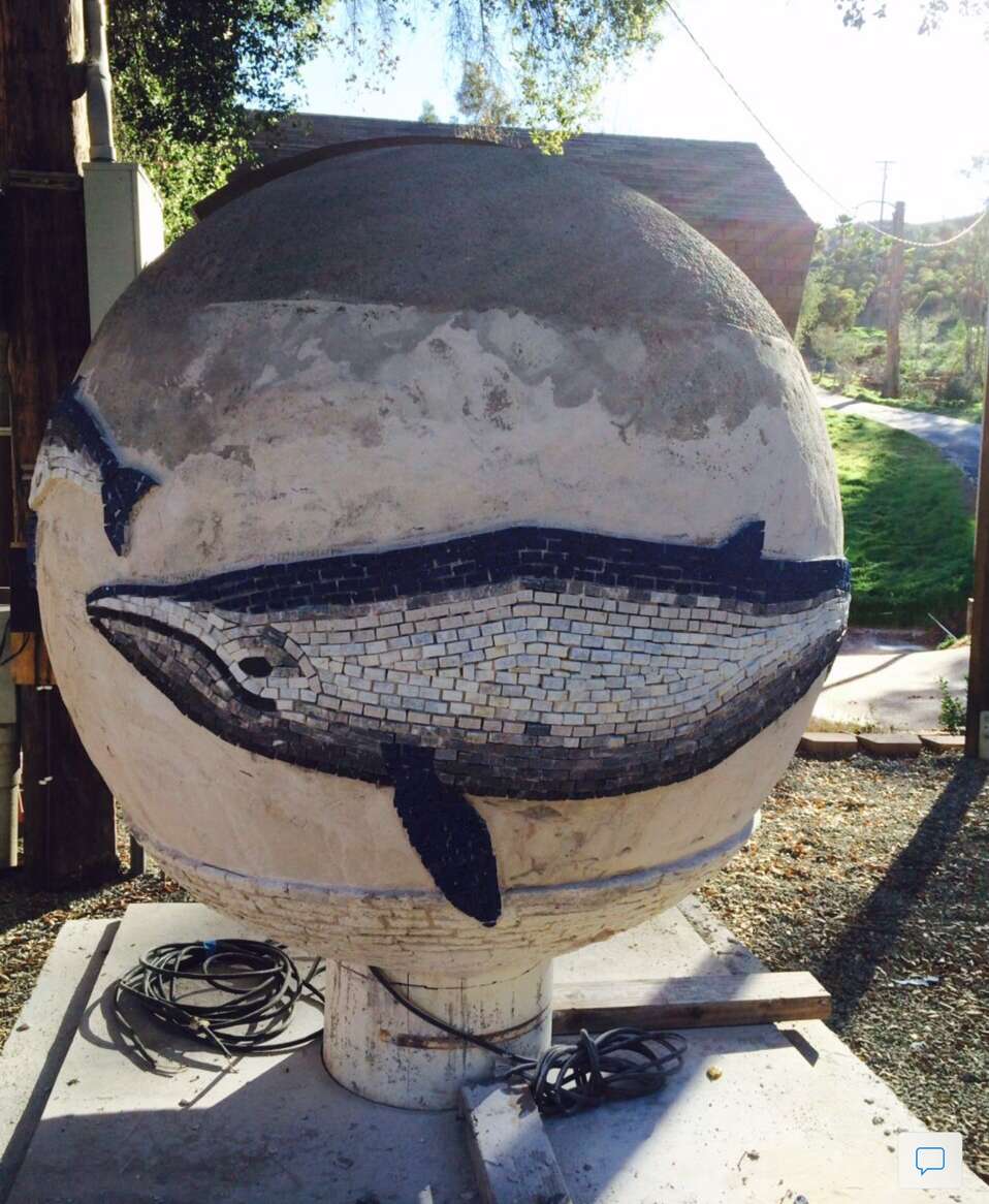 fountain sphere with the beginning mosaic work showing a large whale