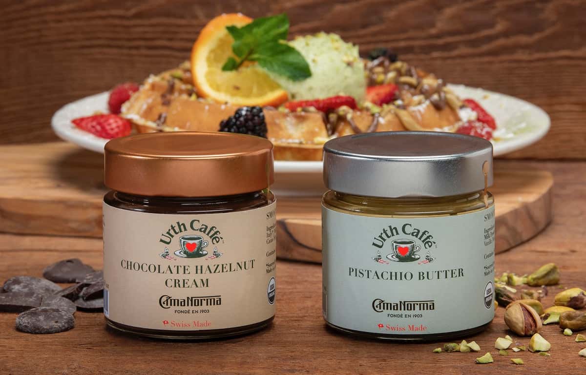 Jars of Urth Pistachio Butter & Hazelnut Cream in front of delicious Urth Pistachio Waffle