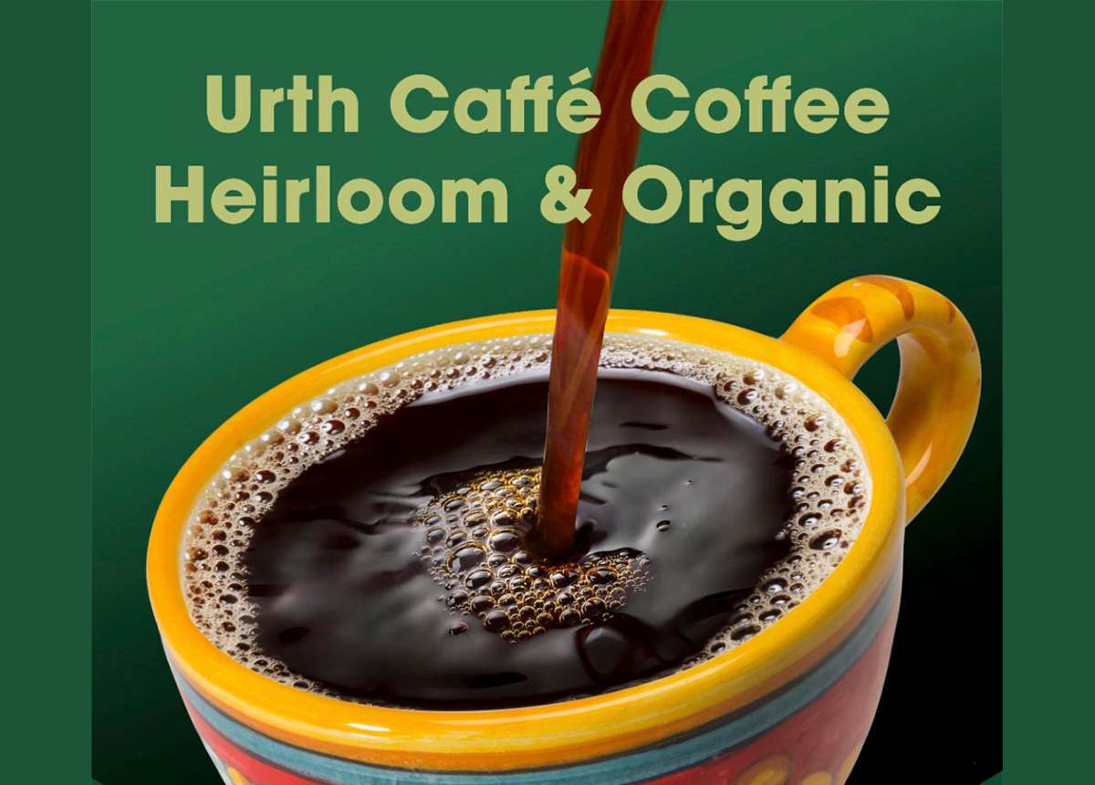 Coffee pouring into painted ceramic coffee cup. Text above cup reads: Urth Caffé Coffee Heirloom & Organic