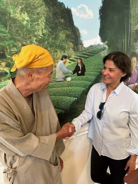 Urth Co-Founder Jilla Berkman and Akihiro Nakai in front of Mural at Urth Beverly Hills