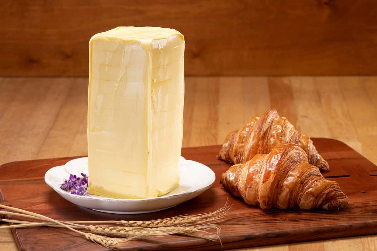Large block of butter and two croissants