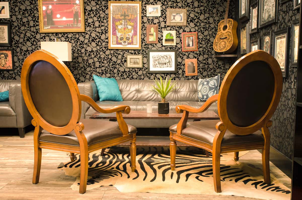 Leather wing back chairs in front of a coffee table