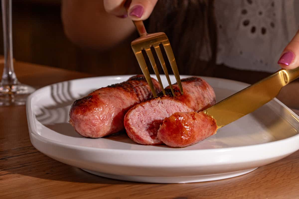 A sausage being sliced
