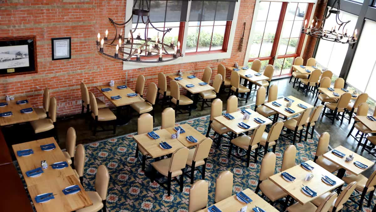 Overhead view of Hugo's restaurant dining room showcasing spacious seating, contemporary design, and an upscale dining experience.
