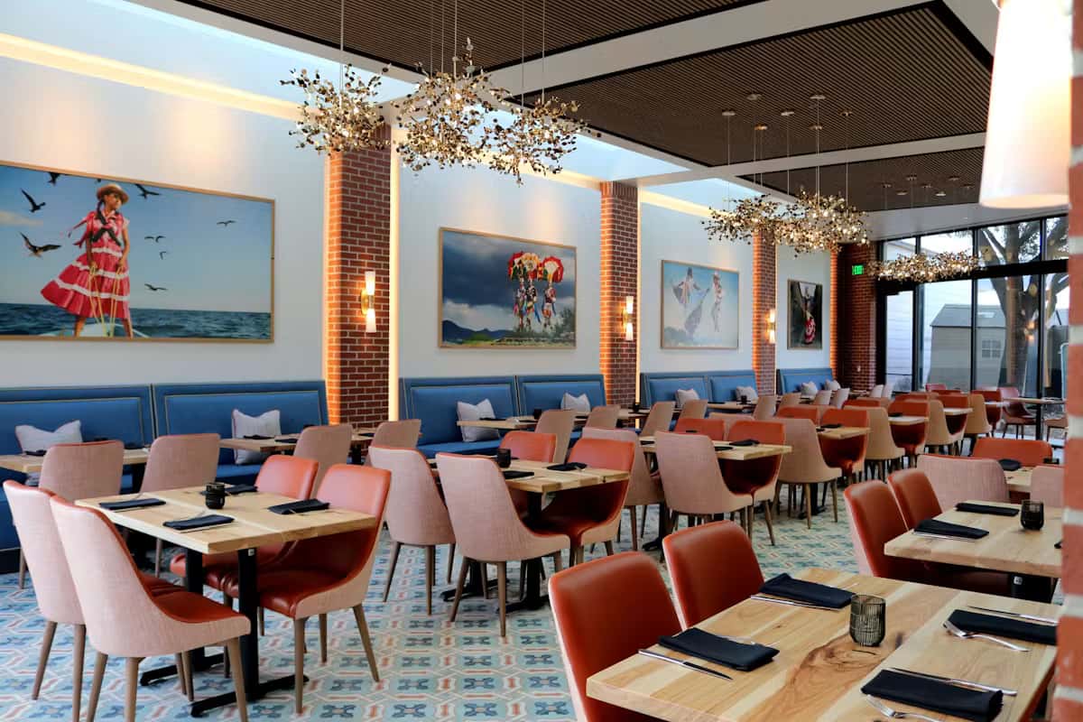 Elegant private dining room at Hugo's restaurant with stylish seating, modern décor, and a warm atmosphere for special events and gatherings.