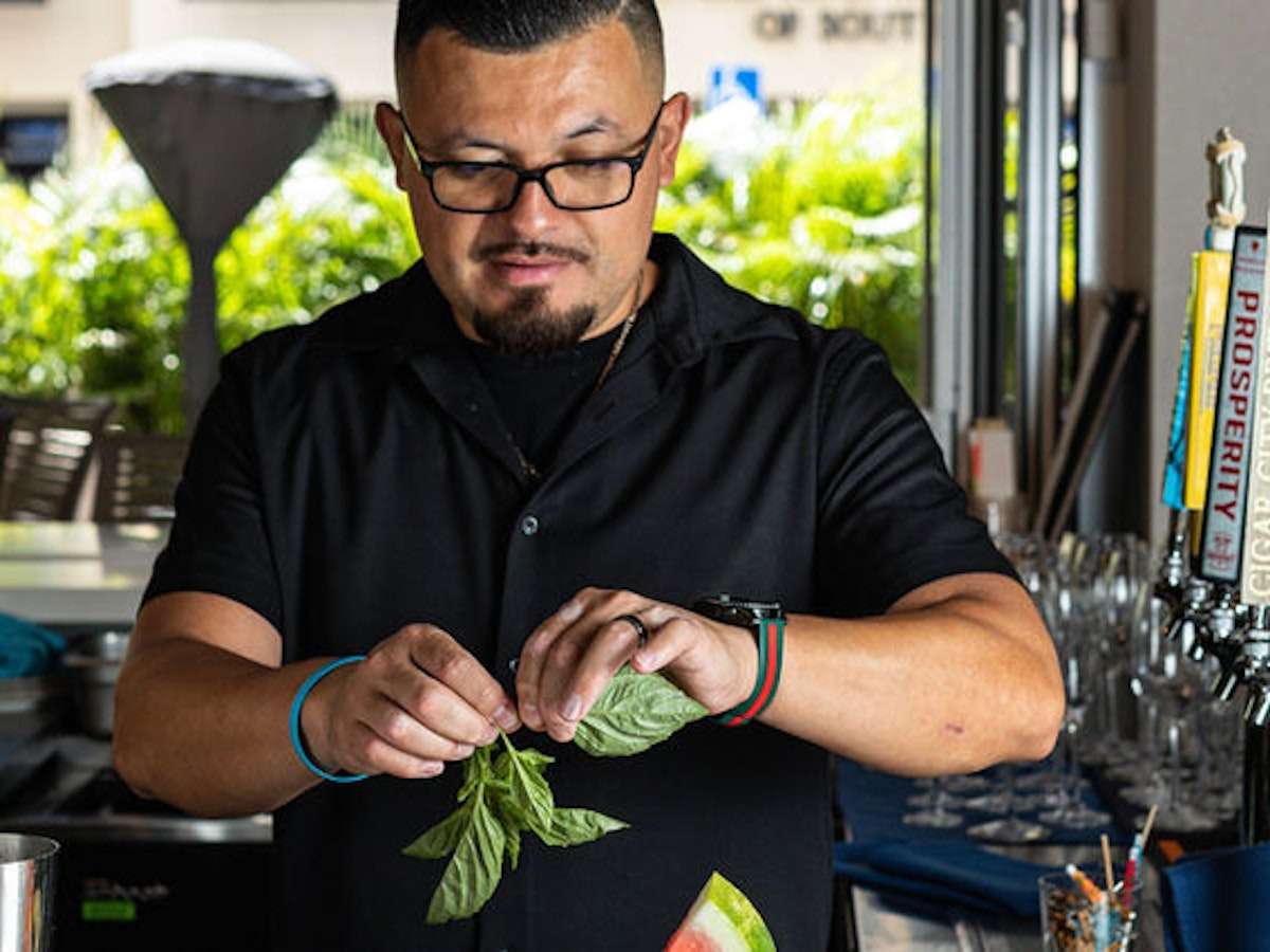 Chef working with basil