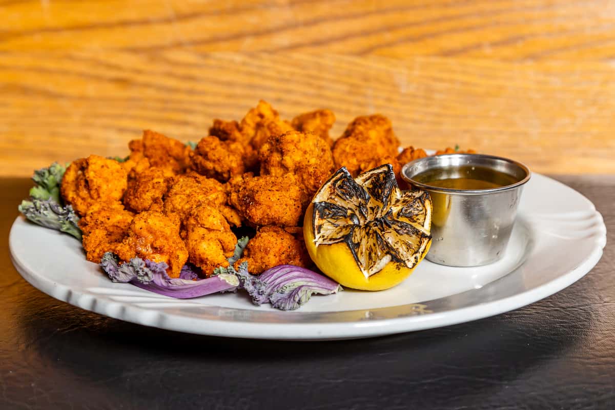 Golden fried lobster bites with grilled lemon and dipping sauce at Gorat's Steak House