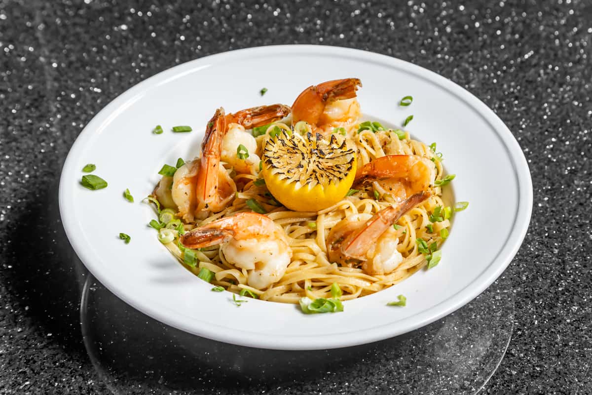 Shrimp scampi pasta with tomatoes, herbs, and Parmesan at Gorat's Steak House