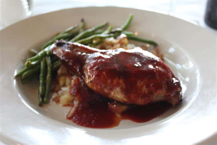 Turkey & Dressing. Turkey breast roasted fresh daily over herb stuffing topped with gravy. Served with mashed potatoes and garlic green beans with fruit chutney garnish