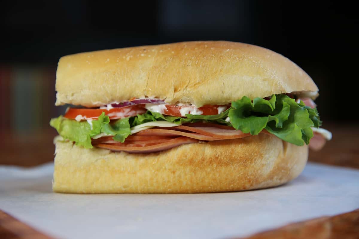Comes with smoked ham and provolone cheese! Recommend adding lettuce, tomato, red onion, mayonnaise, salt & pepper, but the choice is up to you!