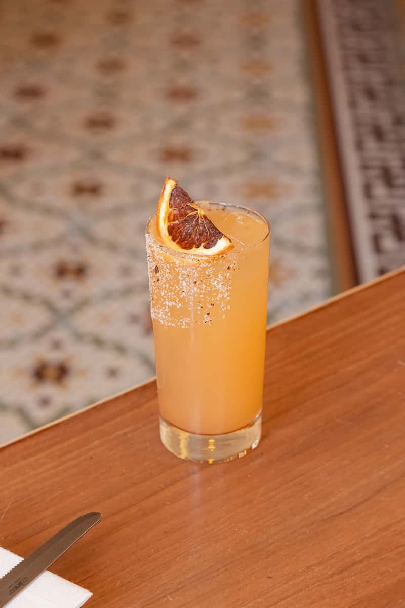 paloma-style mocktail topped with cactus tepache