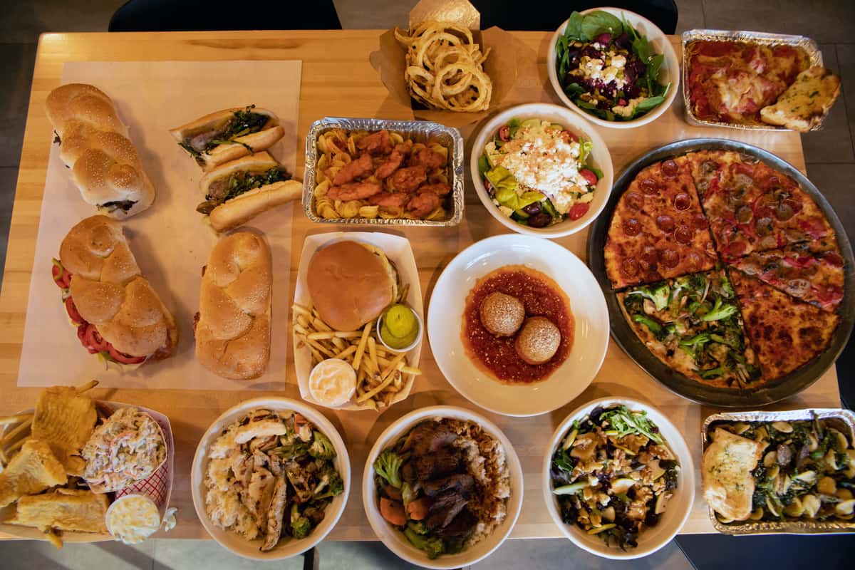 various entrees and salads on a table