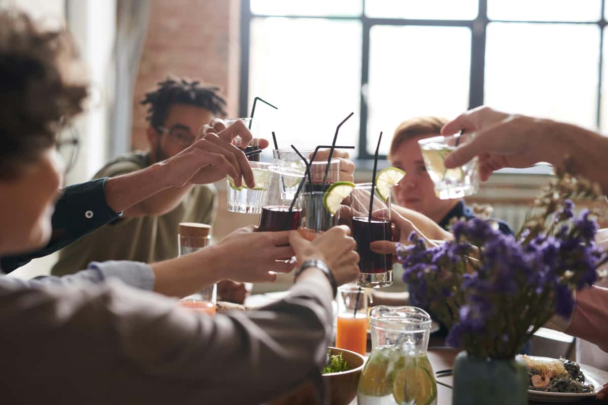 Friends raise glasses in a toast at a gathering at Pierce Creek.