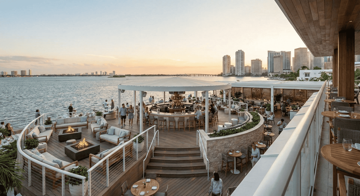 Wide view of Bayshore Club's indoor-outdoor waterfront layout and 360-degree bar.