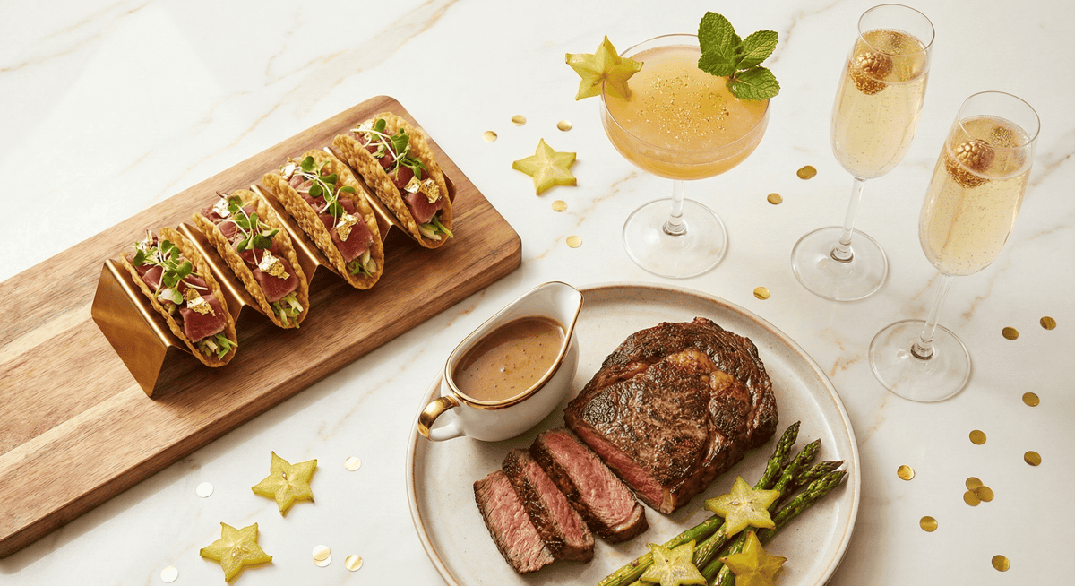 Bayshore Club's signature New Year's Eve dishes and cocktails including tacos, steak, and champagne.
