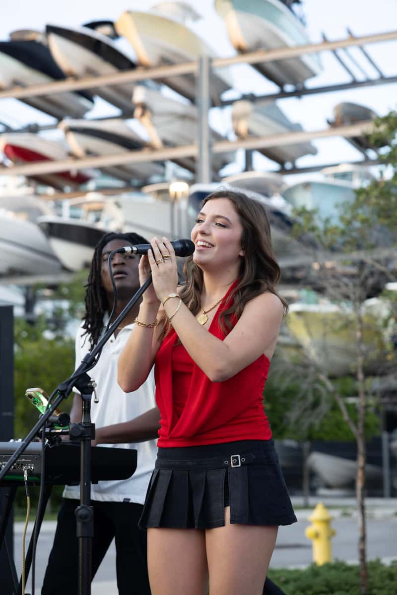 Live music performance at Bayshore Club waterfront event space creating entertainment for a graduation celebration