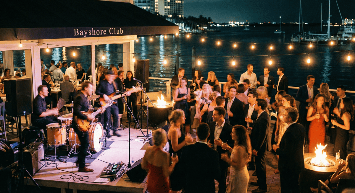 Live music and festive crowd at Bayshore Club during New Year's waterfront celebration.