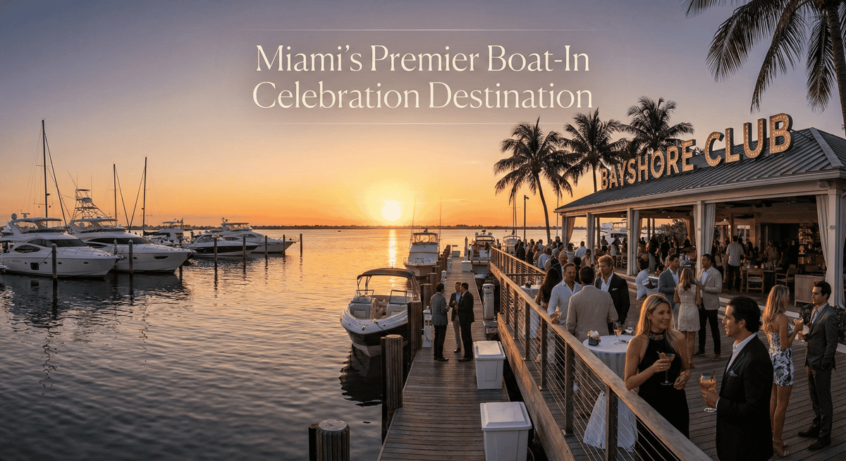 Waterfront venue on Biscayne Bay with boats docked and guests celebrating at sunset.