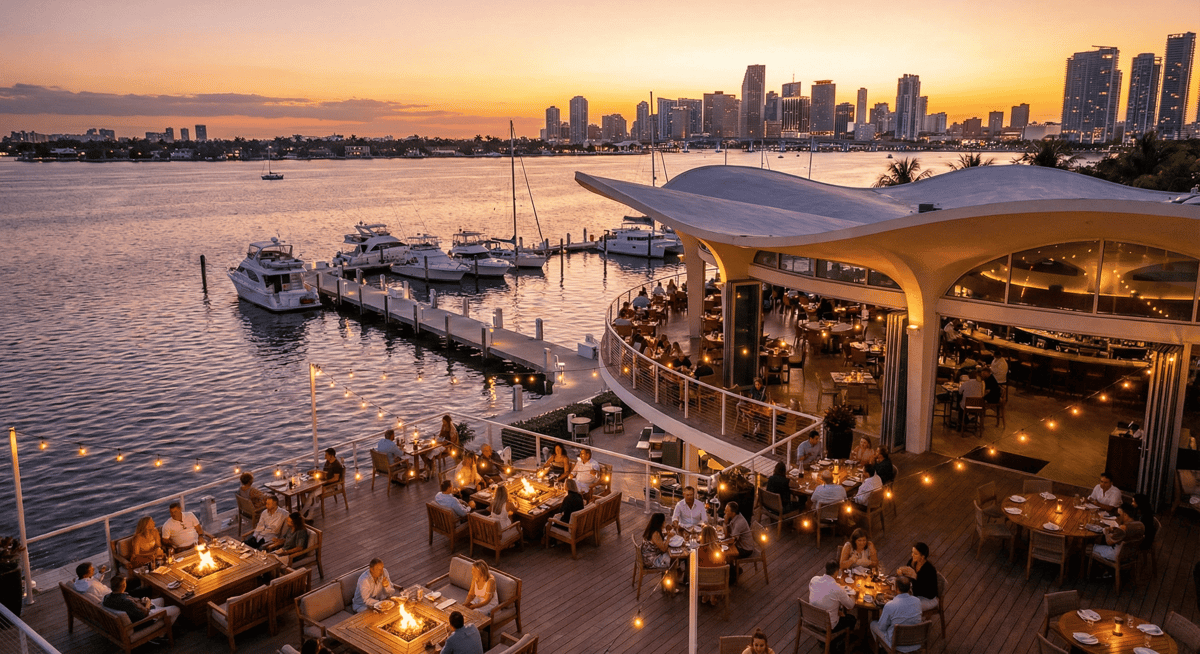 Bayshore Club guests dining at sunset with Biscayne Bay in the background on New Year's Day.