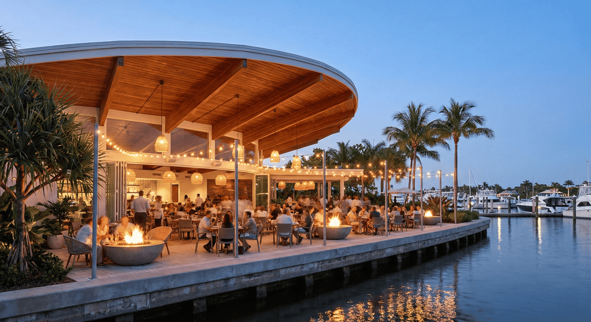 Open-air mid-century modern design with fire pits and waterfront seating at Bayshore Club.