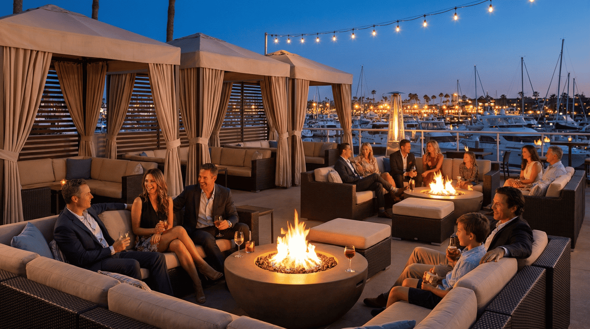Outdoor cabanas and lounge seating at Bayshore Club overlooking Biscayne Bay at night