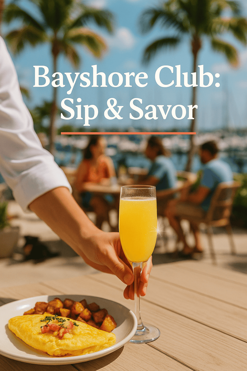 Close-up of a Lobster & Queso Omelet with a fresh mimosa on Bayshore Club's waterfront patio.