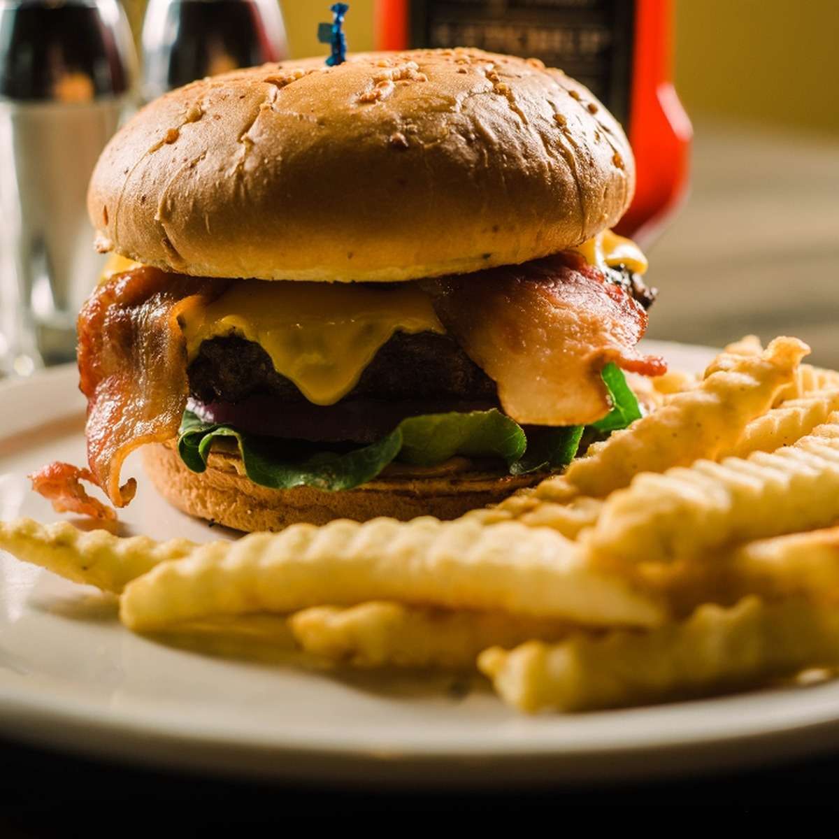 Burger served with crinkle-cut fries