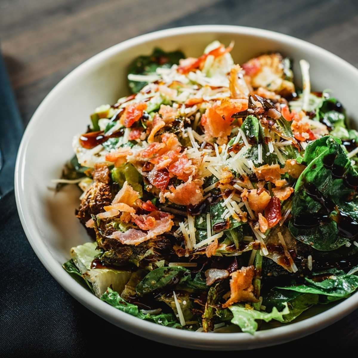 Fresh salad bowl with chopped toppings