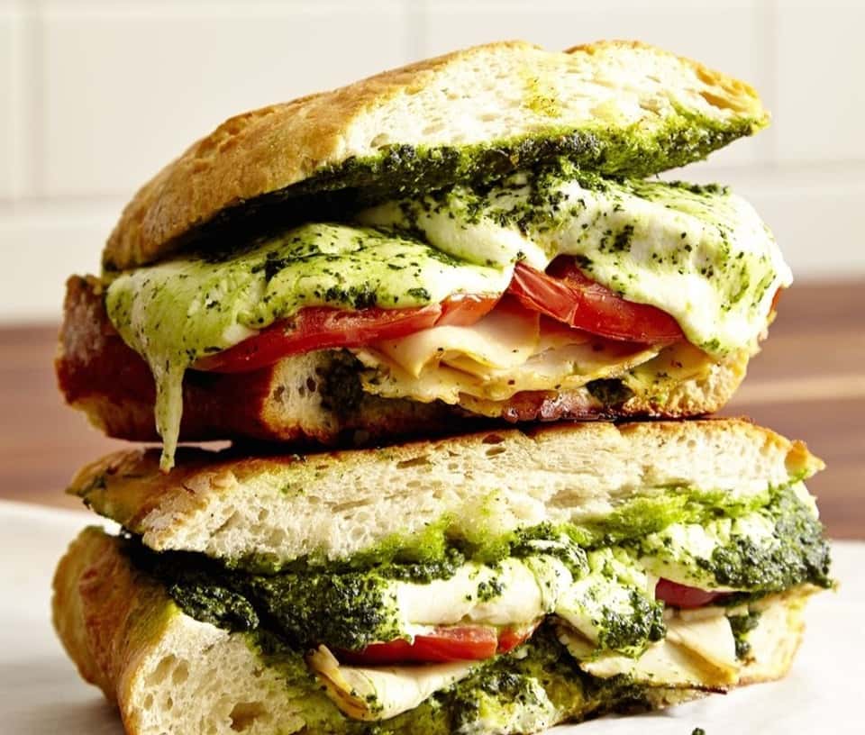 Saucy meat and feta sandwich stacked on each other