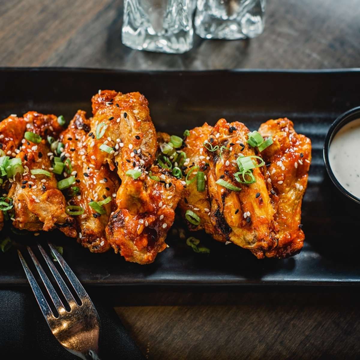 Sticky wings with a garnish topping