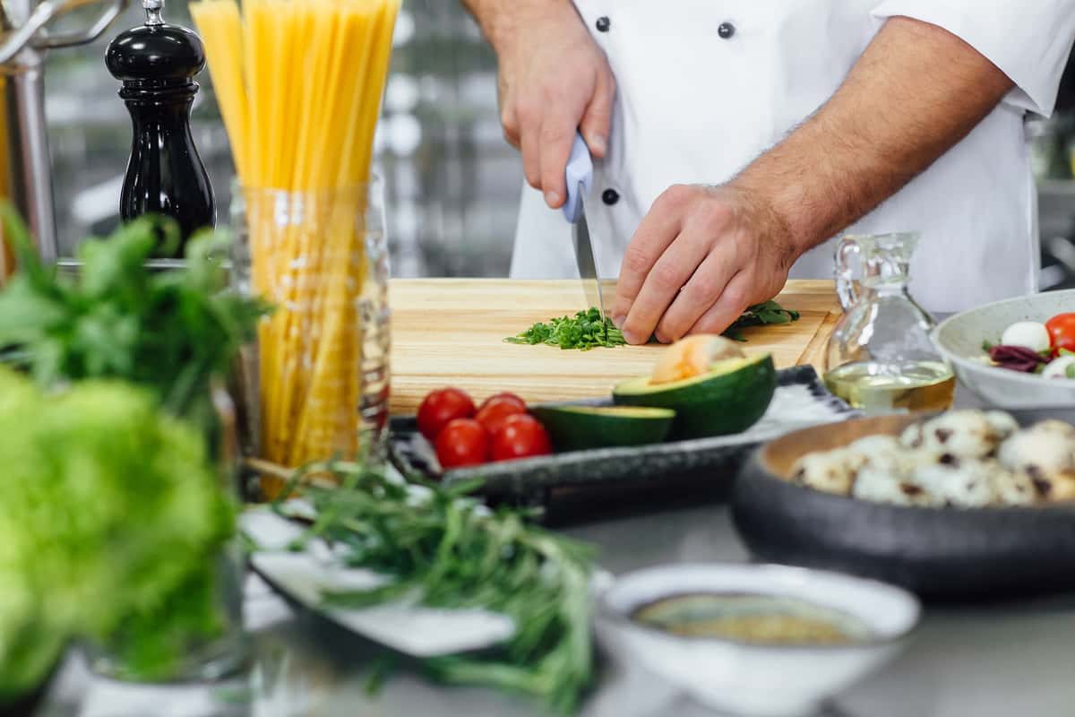 Chef prepping herbs 