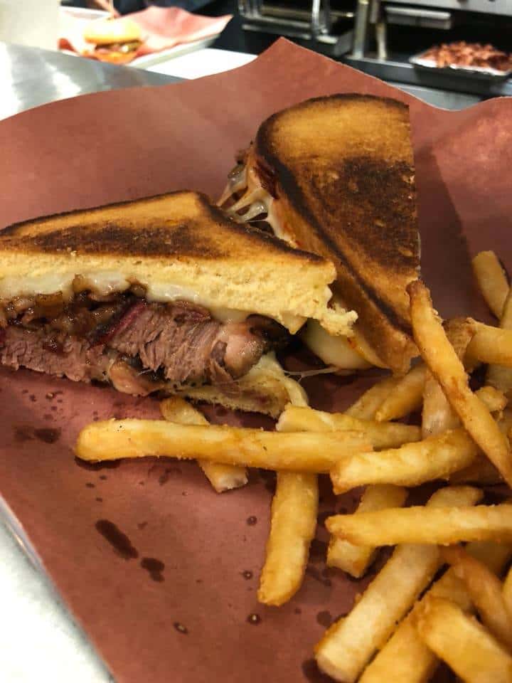 griled cheese with brisket and served with fries