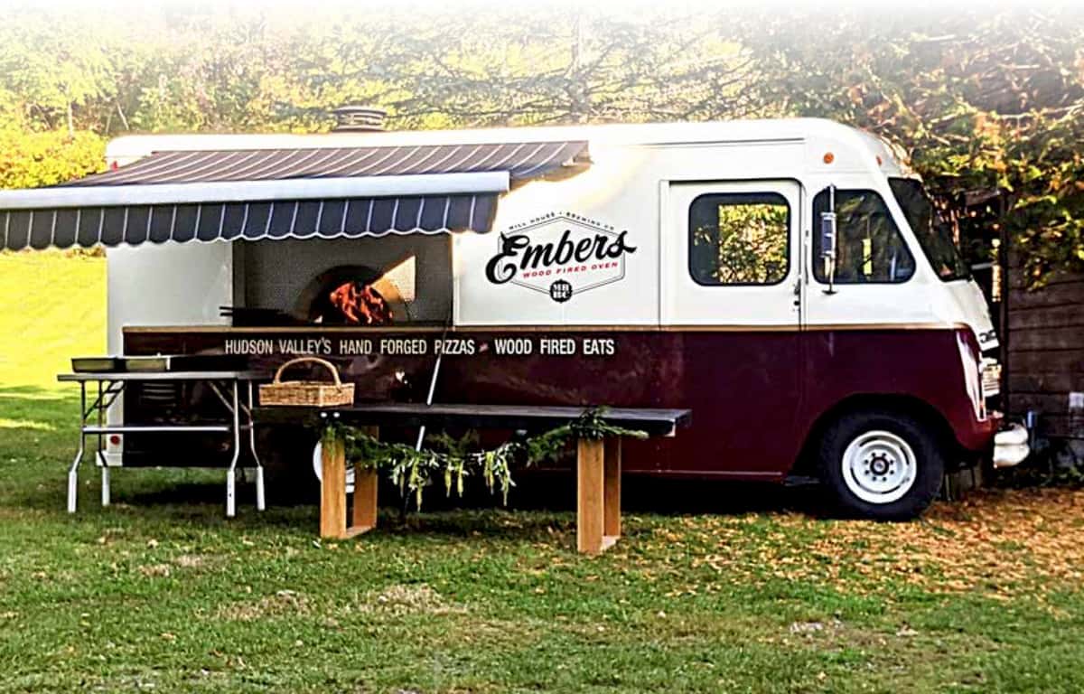 a pizza truck set up for an event