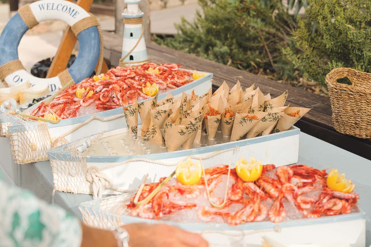 seafood in boat displays outside at an event